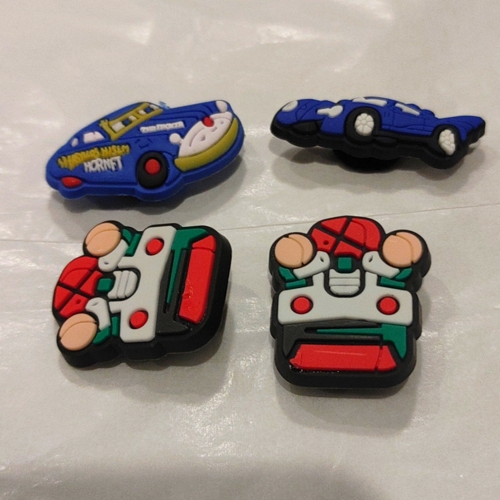 4 PCS of figurine shoe charms New.